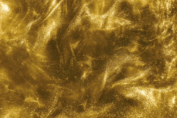 istock gold glitter shimmering magic bokeh background 1193771522