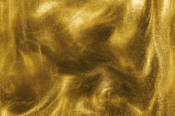istock gold glitter shimmering magic bokeh background 1193771572