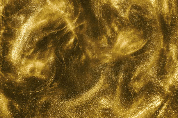 istock gold glitter shimmering magic bokeh background 1193771611