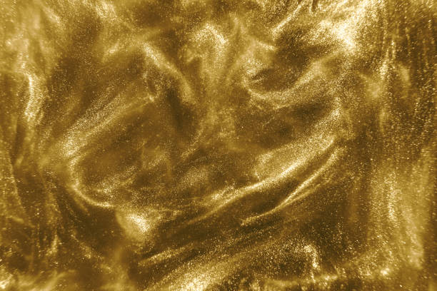 istock gold glitter shimmering magic bokeh background 1193771639