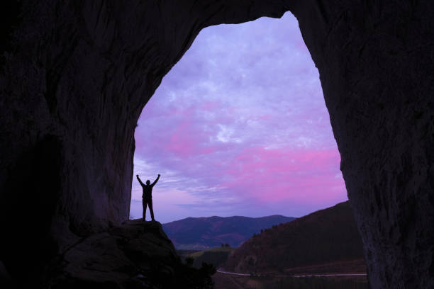 istock man at the exit of a cave in Aitzulo, Gipuzkoa 1193772486
