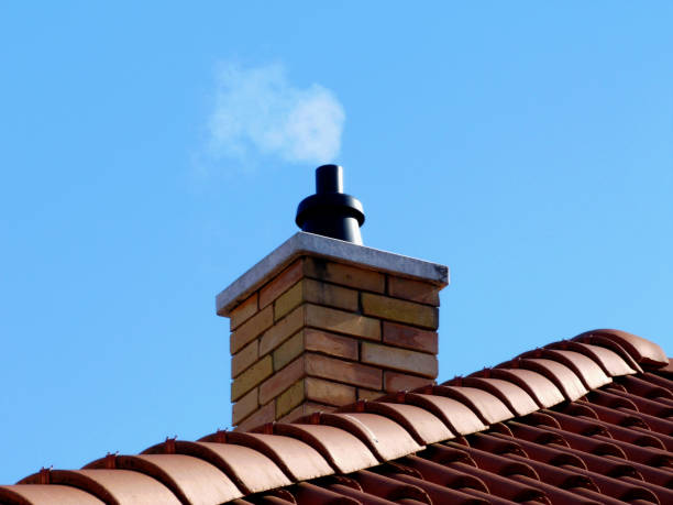istock yellow brick chimney and light brown clay tile roof 1193773532