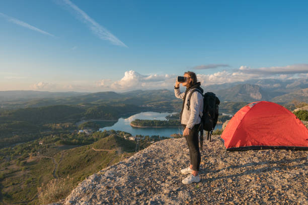 istock The young backpacker man with glasses of virtual reality . 1193774820