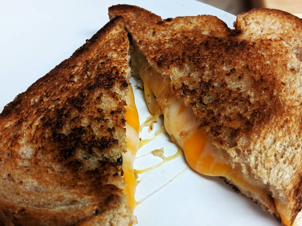 istock Gooey, Grilled Cheese Slices on White Background 1193775930