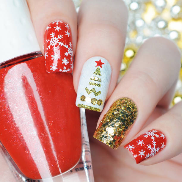 istock christmas manicure with snowflakes and christmas tree 1193776058