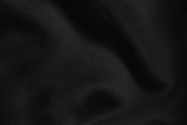 istock Black colored Background of soft draped fabric 1193776251