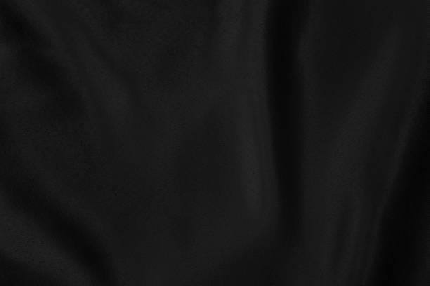istock Black colored Background of soft draped fabric 1193776255