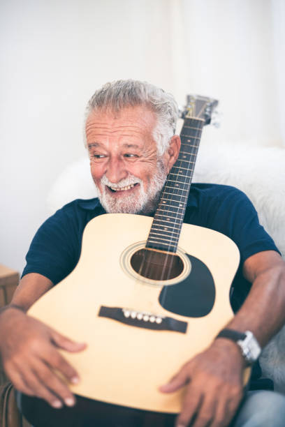 istock Grandfather hugged the guitar and smiled. 1193777667