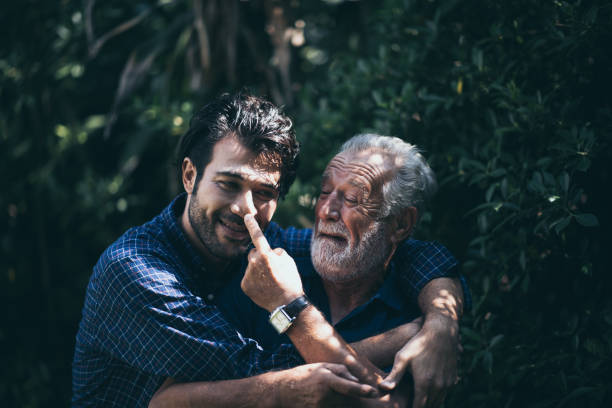 istock Son hugs his own father 1193777875