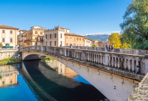 Rieti (Sabina, Italy) Rieti, Italy - 9 November 2019 - The historical center of the Sabina's provincial capital, under Mount Terminillo and crossed by the river Velino, during the autumn. Here in particular: the river with palace and brigde rieti stock pictures, royalty-free photos & images