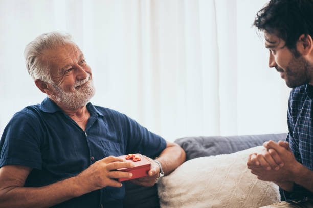 istock father is happy with the gift box that his son gave. 1193778609