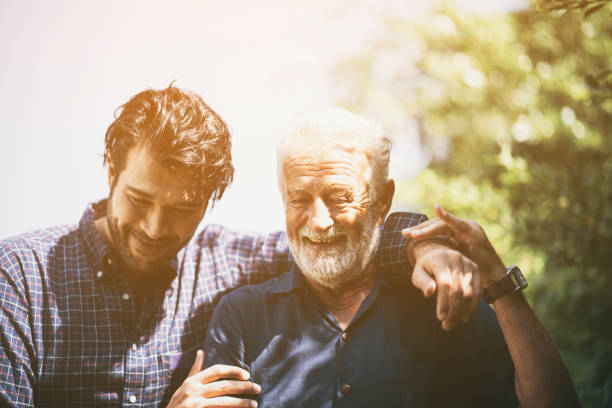 istock Hipster son with his senior father at home. 1193778611