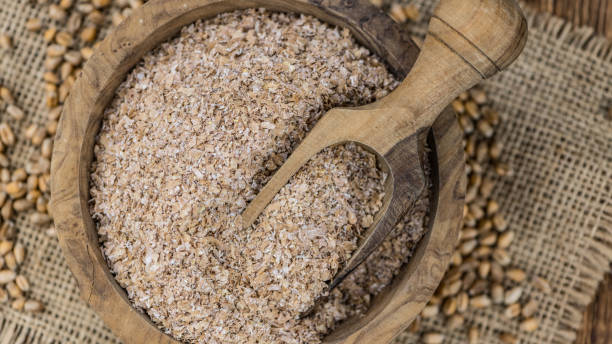 istock Vintage wooden table with Wheat Bran (selective focus; close-up shot) 1193779132