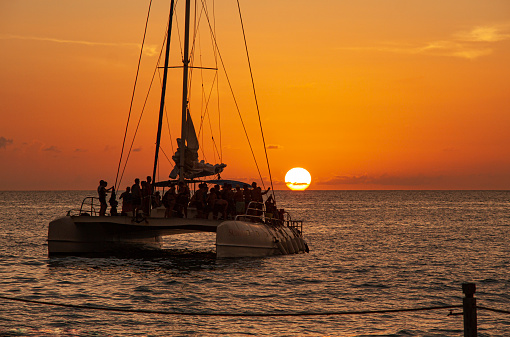Catamaran sails at sunset in Bayahibe, Dominican Republic