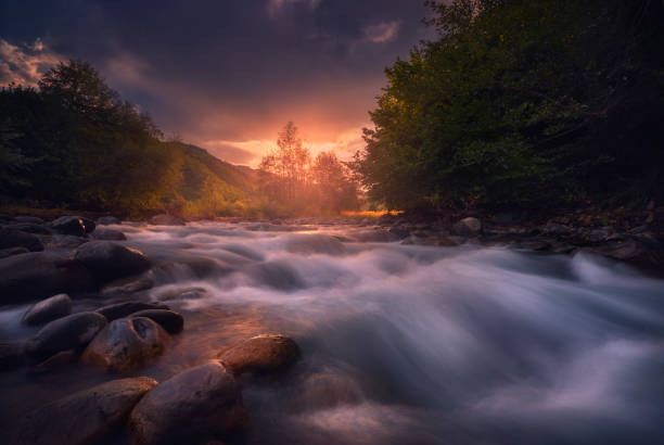 istock beautiful sunrise over fast flowing mountain river 1193786546