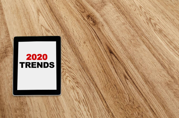 2020 trends written on tablet screen stock photo
