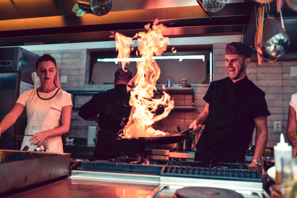 Flaming Pan As Part Of A Special Recipe In Modern Kitchen