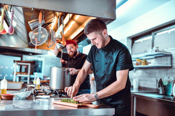 istock The Kitchen Is Bustling With Happy Chefs 1193789530