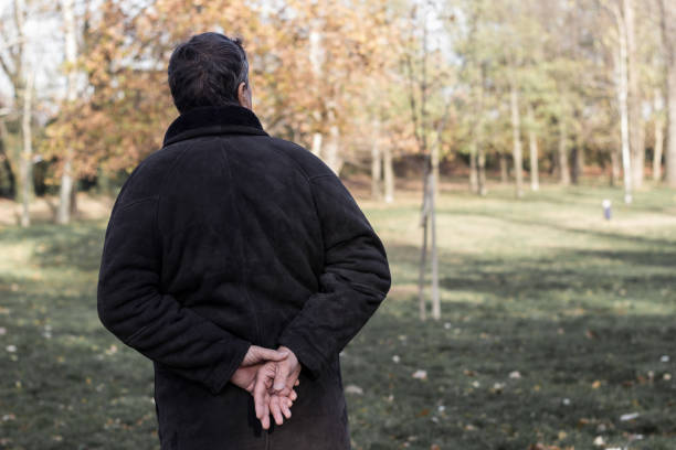 istock Senior man walking and relaxing in park 1193789533