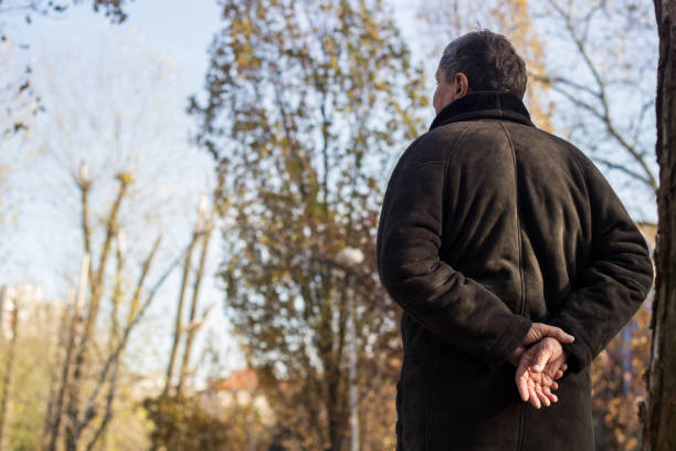 Senior man walking and relaxing in park