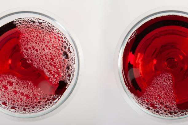 istock Glass of red wine with shadow. Top view. Abstract red wine bubbles. 1193789571