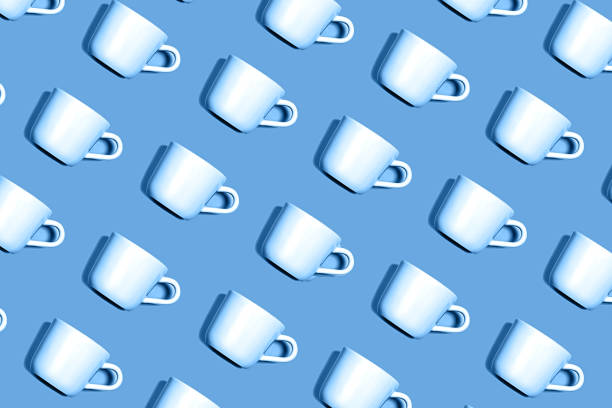 Coffee pattern of white cup for coffee on classic blue color background. Pop art minimal flat lay style design, creative concept. Top view. Copy space. Classic Blue color 2020 concept.