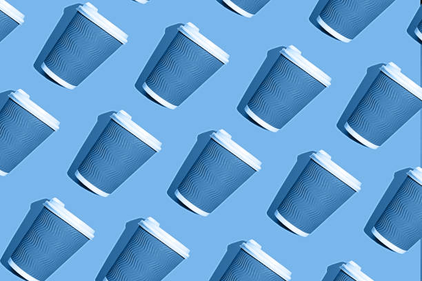 istock Coffee pattern of blue paper cup for coffee on bright classic blue background. 1193791401