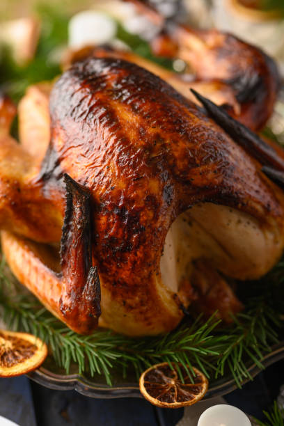 istock Christmas table, festive baked turkey, and served table. Vertical frame 1193792776