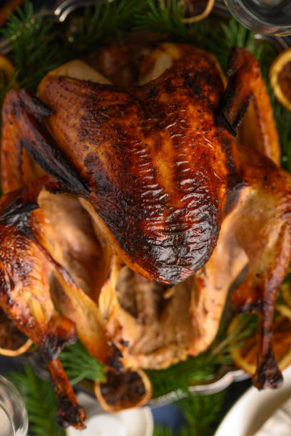 istock Christmas table, festive baked turkey, and served table. Vertical frame 1193794690