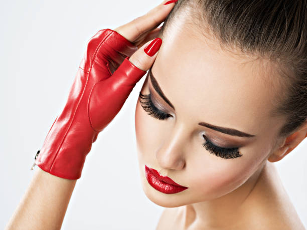 Portrait of a nice looking woman with red lips and beautiful tiara. Professional make up and hair style.