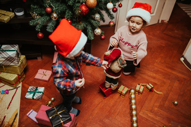 istock Children with Christmas present during holiday at home 1193798145