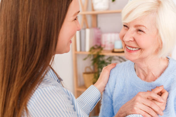 istock Mom and daughter looking each other and smiling 1193802291