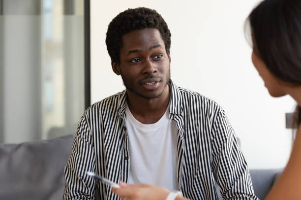 istock African American male talk with colleague discussing project 1193802329