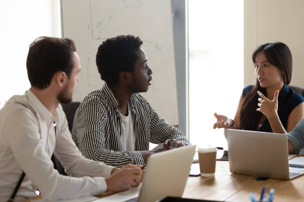 istock Multiethnic diverse employees brainstorm at meeting in office 1193802365