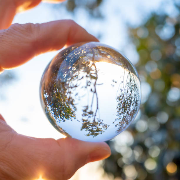 istock Crystal ball and morning landscape 1193809699