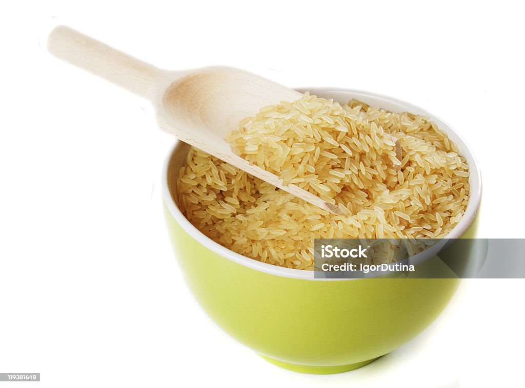 Raw arroz em uma tigela isolada no branco " - Foto de stock de Arroz - Alimento básico royalty-free
