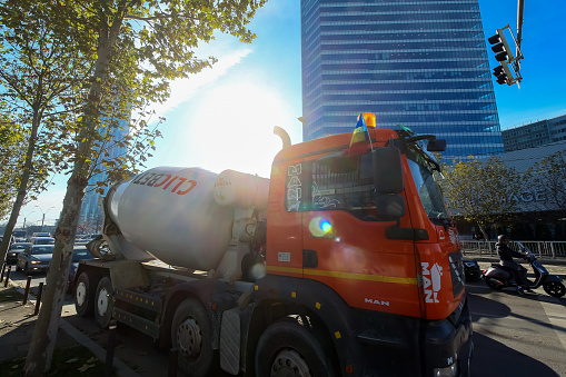 Bucharest, Romania - December 09, 2019: A ClicBeton MAN Truck Concrete mixer from Swiss-based global building materials and aggregates company producer Holcim is in traffic in Bucharest