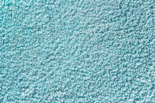 Turquoise seamless terry cloth texture. Monochrom towel background. Close-up of mint color fleecy fabric