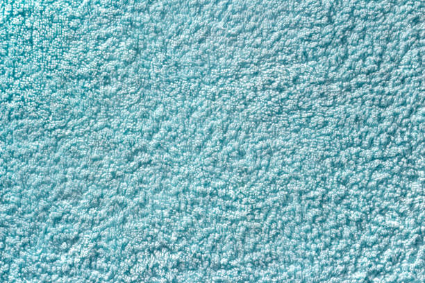 Turquoise seamless terry cloth texture. Monochrom towel background. Turquoise seamless terry cloth texture. Monochrom towel background. Close-up of mint color fleecy fabric terry towel stock pictures, royalty-free photos & images