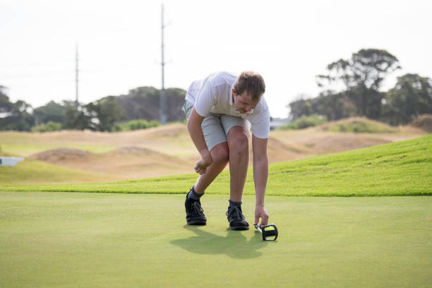 istock Golfer with a disability prepares a long putt 1193822587