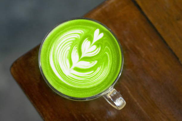 istock matcha green tea latte on wood table,aerial view 1193824161