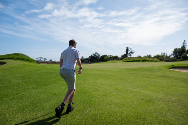 istock Golfer with disabilities takes walking down fairway 1193824809