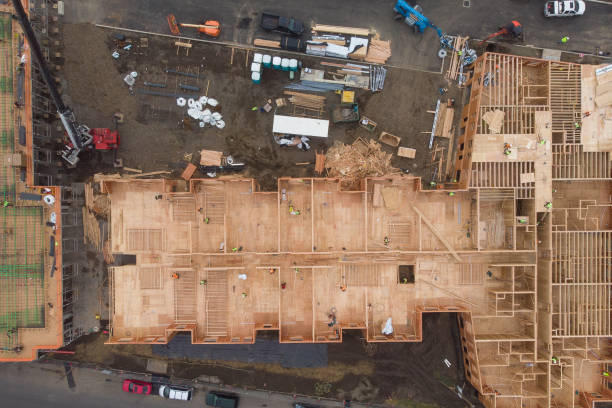 istock Construction and construction of high-rise buildings, the construction industry with working equipment and workers. View from above, from above. Background and texture 1193825899