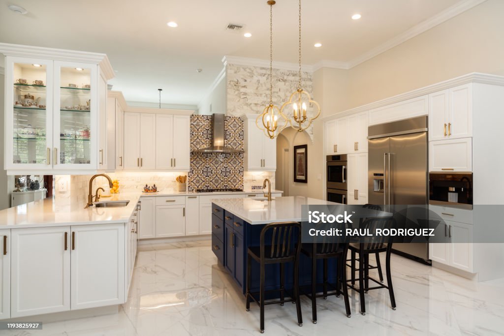 Luxury White Kitchen Design Beautiful luxury estate home kitchen with white cabinets. Kitchen Stock Photo