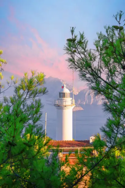 Cape Gelidonia lighthouse surrounded by pine trees in the Mediterranean Sea. Pirate Bay. Lycian trail. Turkey Kemer