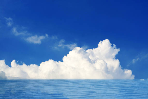 istock reflection white pure heap cloud sunshine in the blue sky and sunlight on sea surface 1193842939