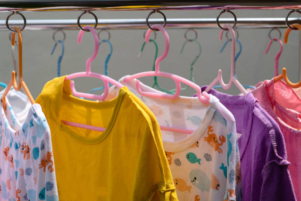 istock Clothes and children's dresses in various colors. 1193845448