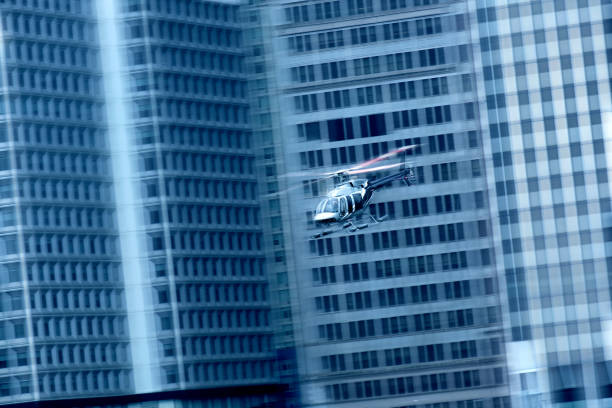 Helicopter is flying against isolated on grey background