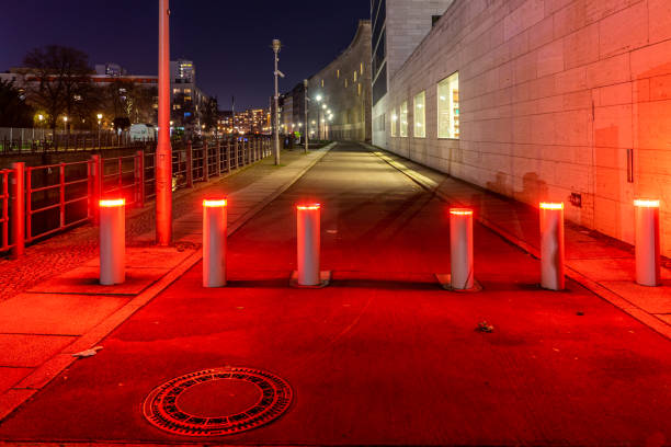 istock Illuminated Street Lights On Road At Night 1193856180