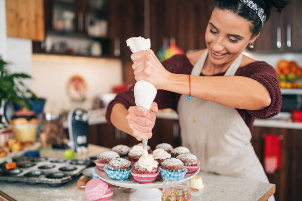 istock Confectioner decorating Chocolate Muffins 1193858415